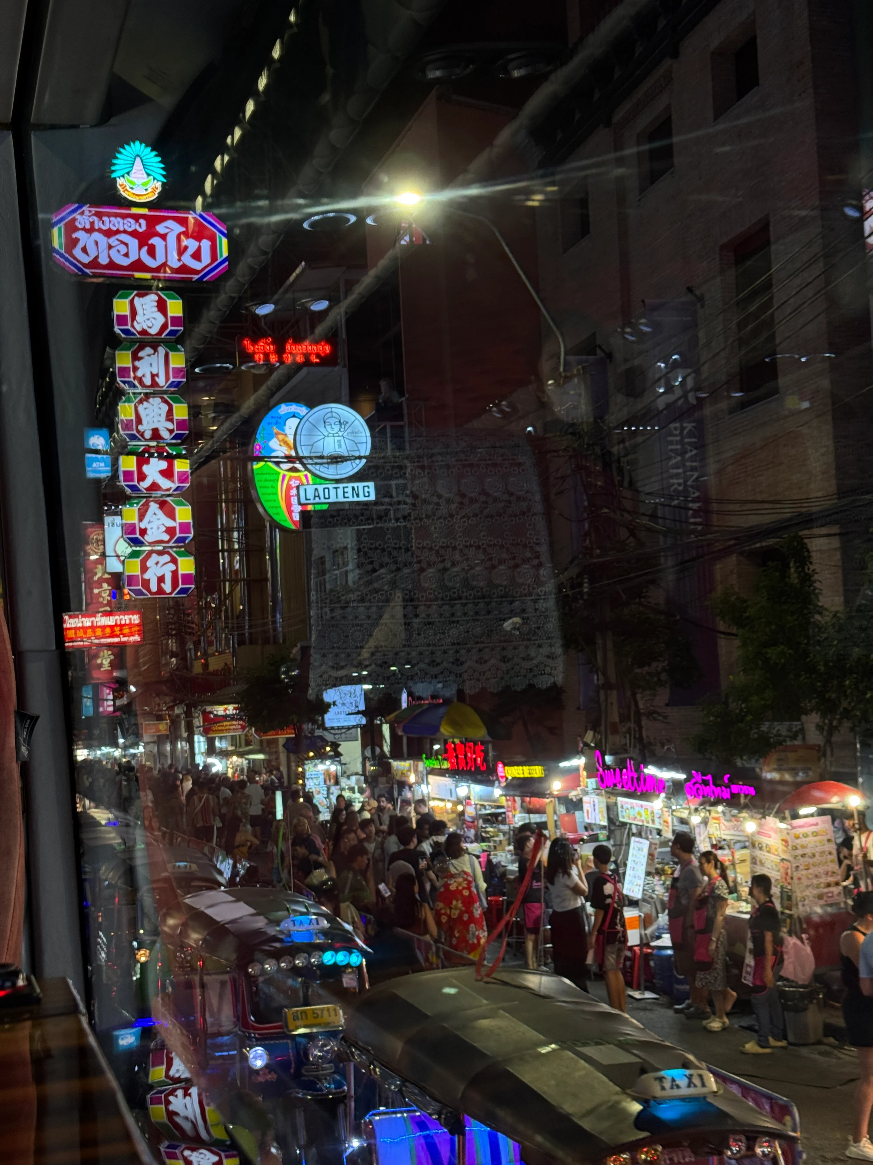 Thai Bus Food Tour team members and guests posing together at storefront entrance