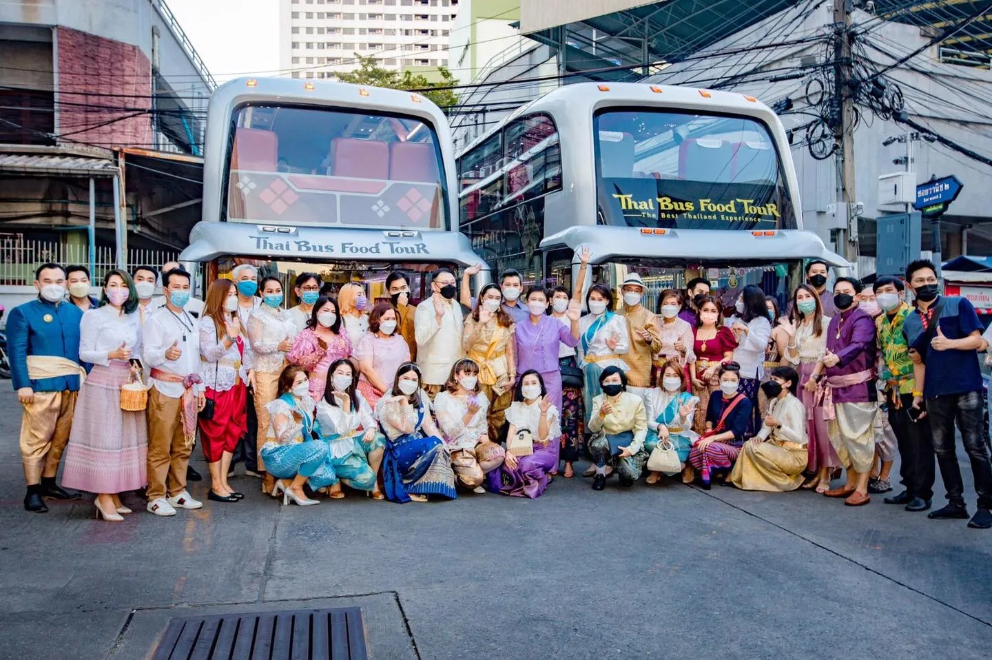 Interior of tour bus showing comfortable red quilted seats and window views